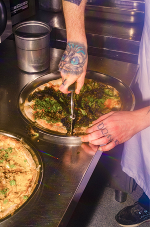 A chef preparing food in Bergen